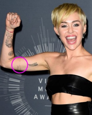 Miley Cyrus’ “I’m In Your Corner” Johnny Cash Tattoo on Her Bicep