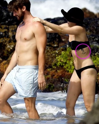 Miley Cyrus Flaunts New Naked Woman Side Tattoo During Hawaii Vacay