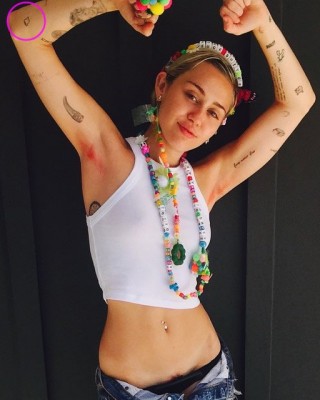 Miley Cyrus’ Little Tooth Tattoo on Her Elbow