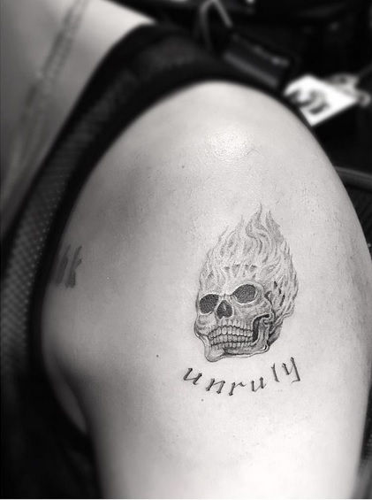 Drake’s New “Unruly” Flaming Skull Tattoo Inspired by Popcaan