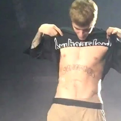 Justin Bieber’s New Abdomen Tattoo Brands Him a “Son of God”