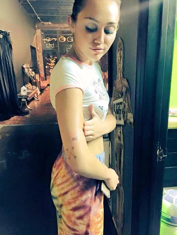 Miley Cyrus Has a Red “OKIE” Tattoo on Her Arm